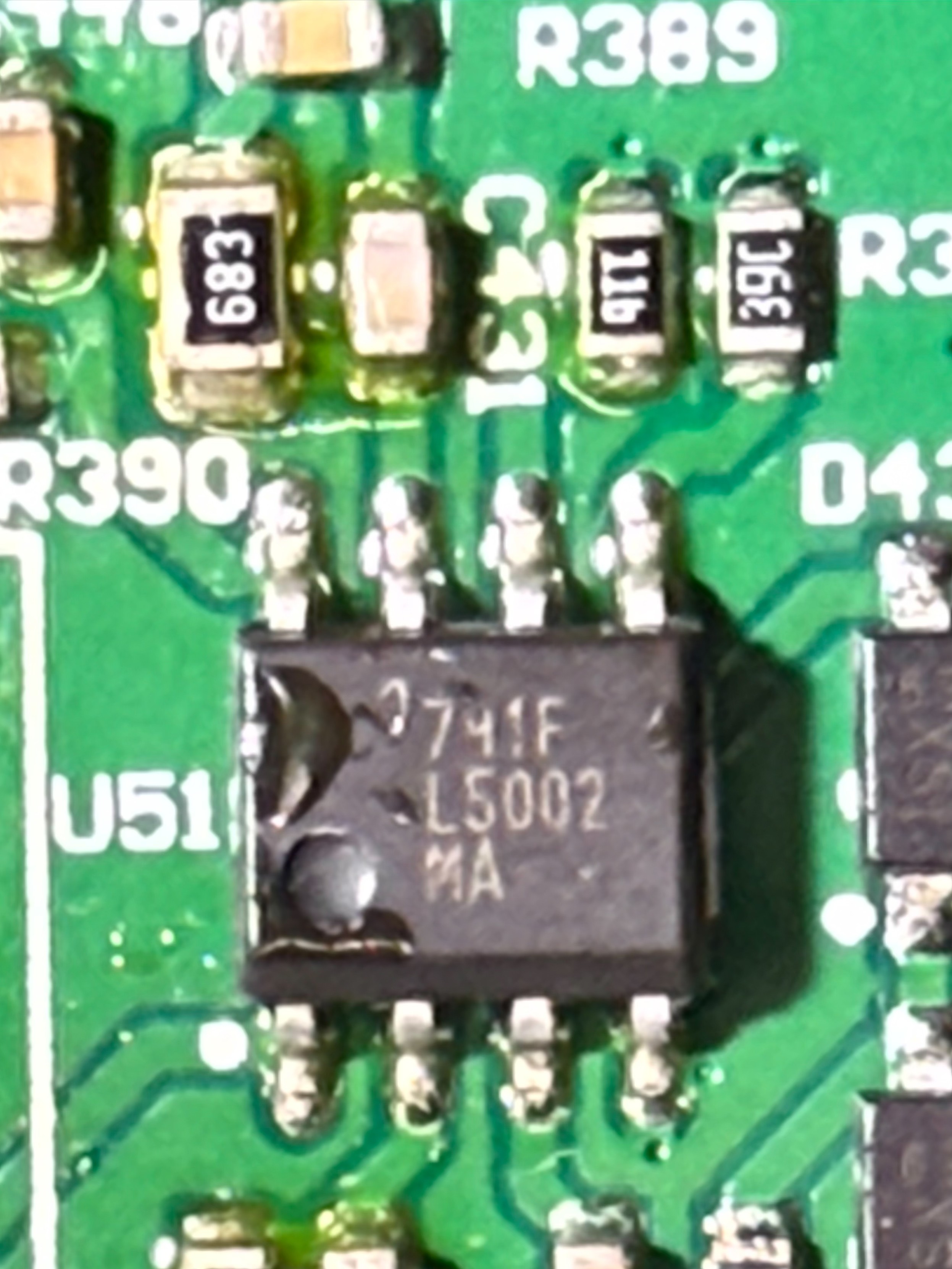 Super closeup of the boost driver chip, marked U51, 741F / L5002 / MA